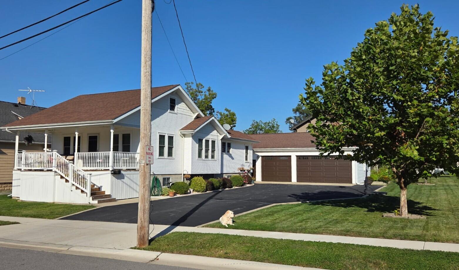 228 Wood Street Crown Point, IN 46307 - Photo 4 of 33 a front view of a house with a garden
