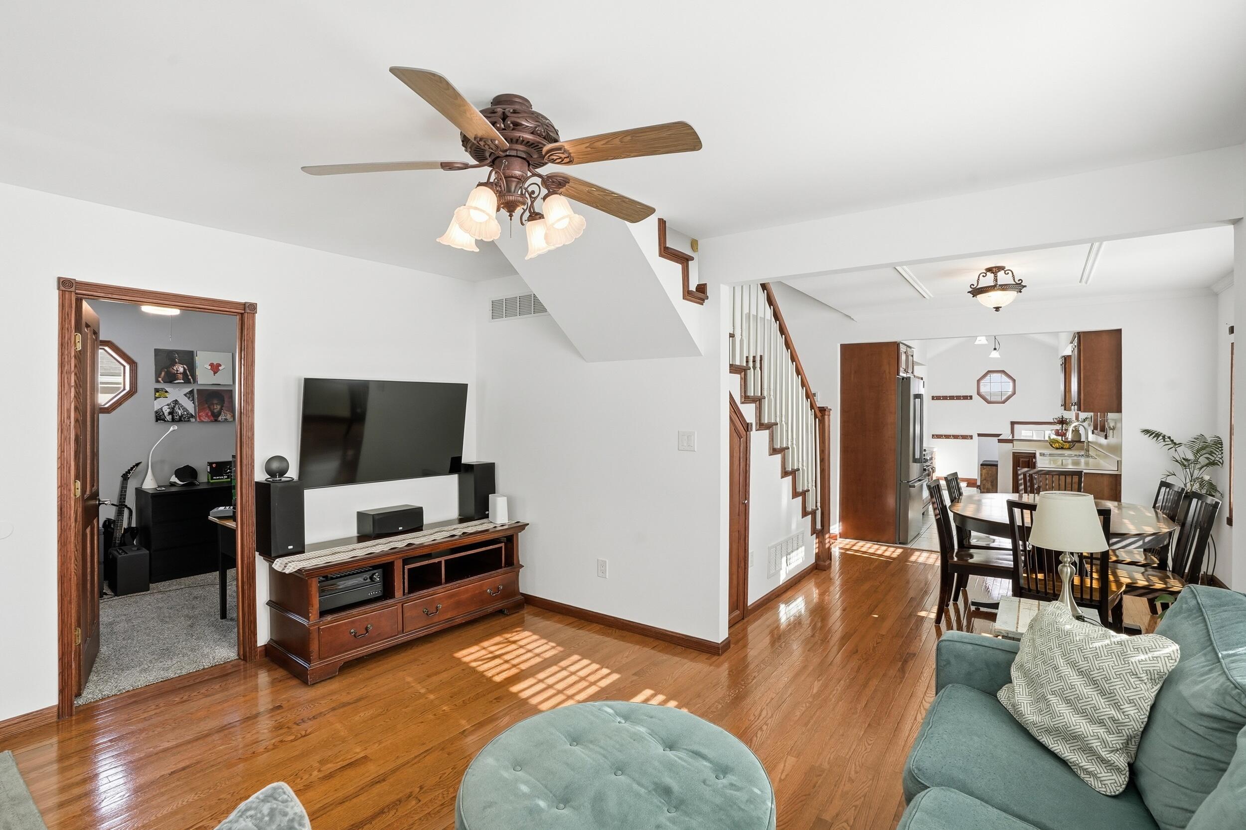 228 Wood Street Crown Point, IN 46307 - Photo 10 of 33 a living room with furniture and a flat screen tv