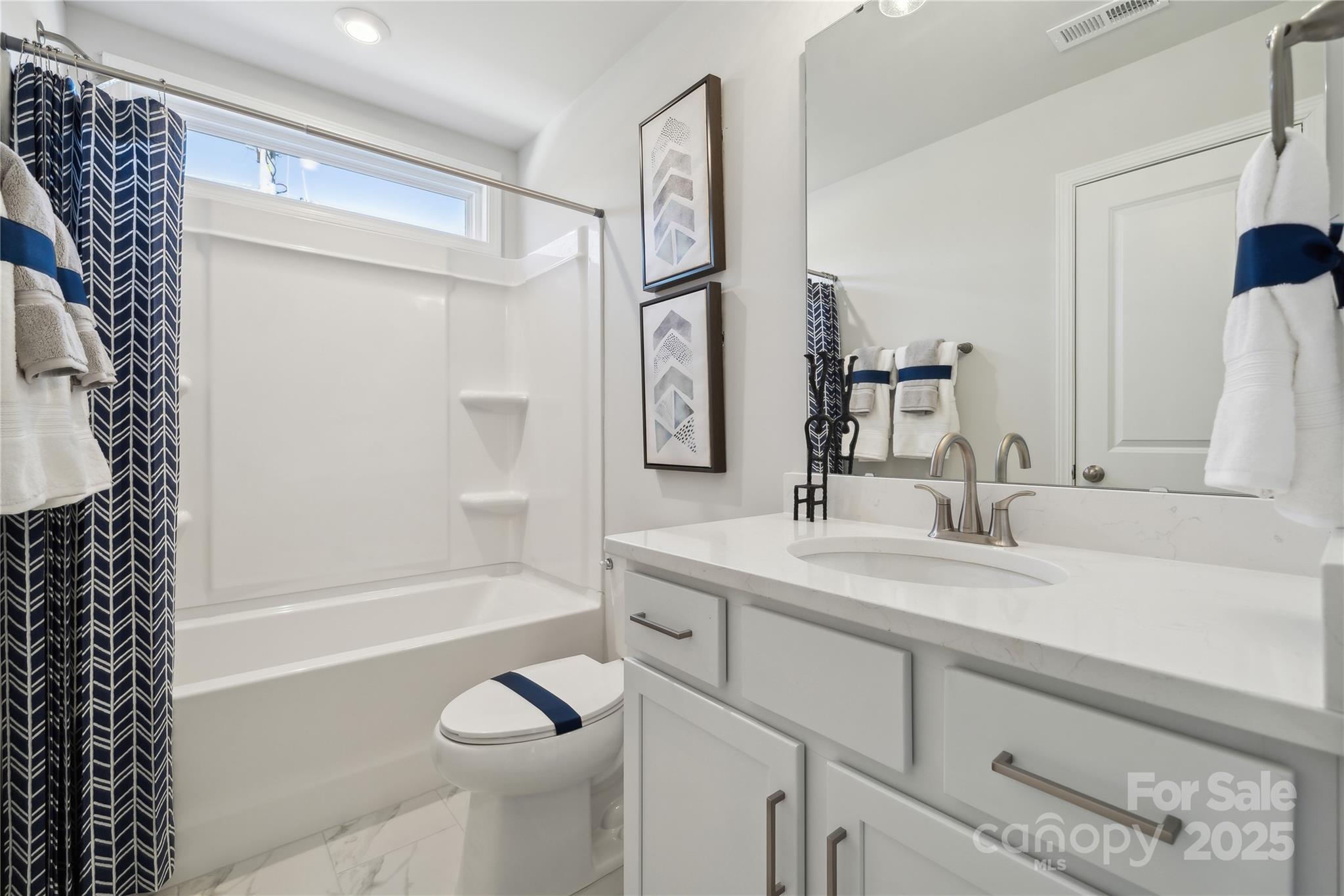 132 Balboa Street Matthews, NC 28104 - Photo 12 of 39 a bathroom with a granite countertop sink toilet and shower