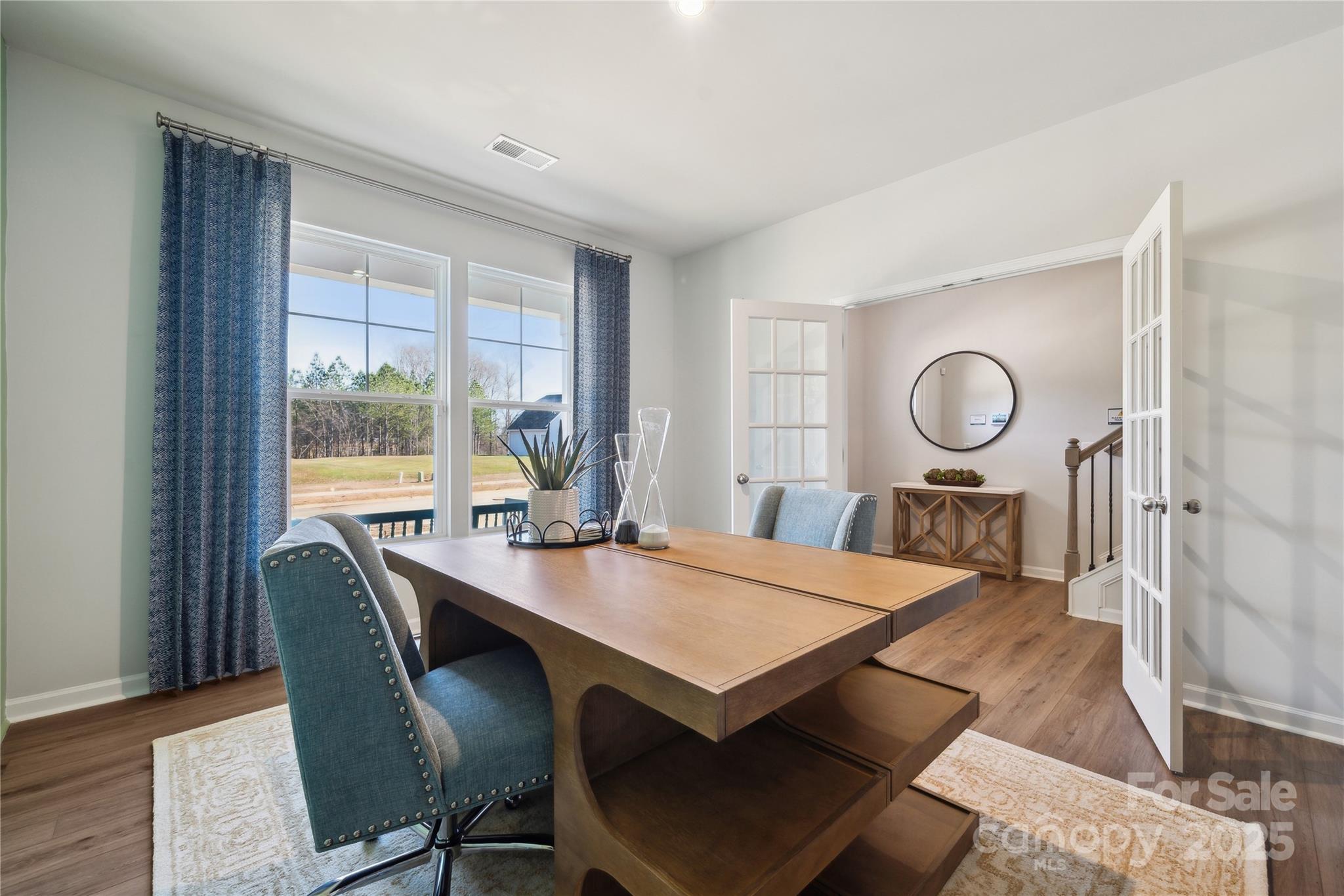 132 Balboa Street Matthews, NC 28104 - Photo 29 of 39 a view of a dining room with furniture window and wooden floor