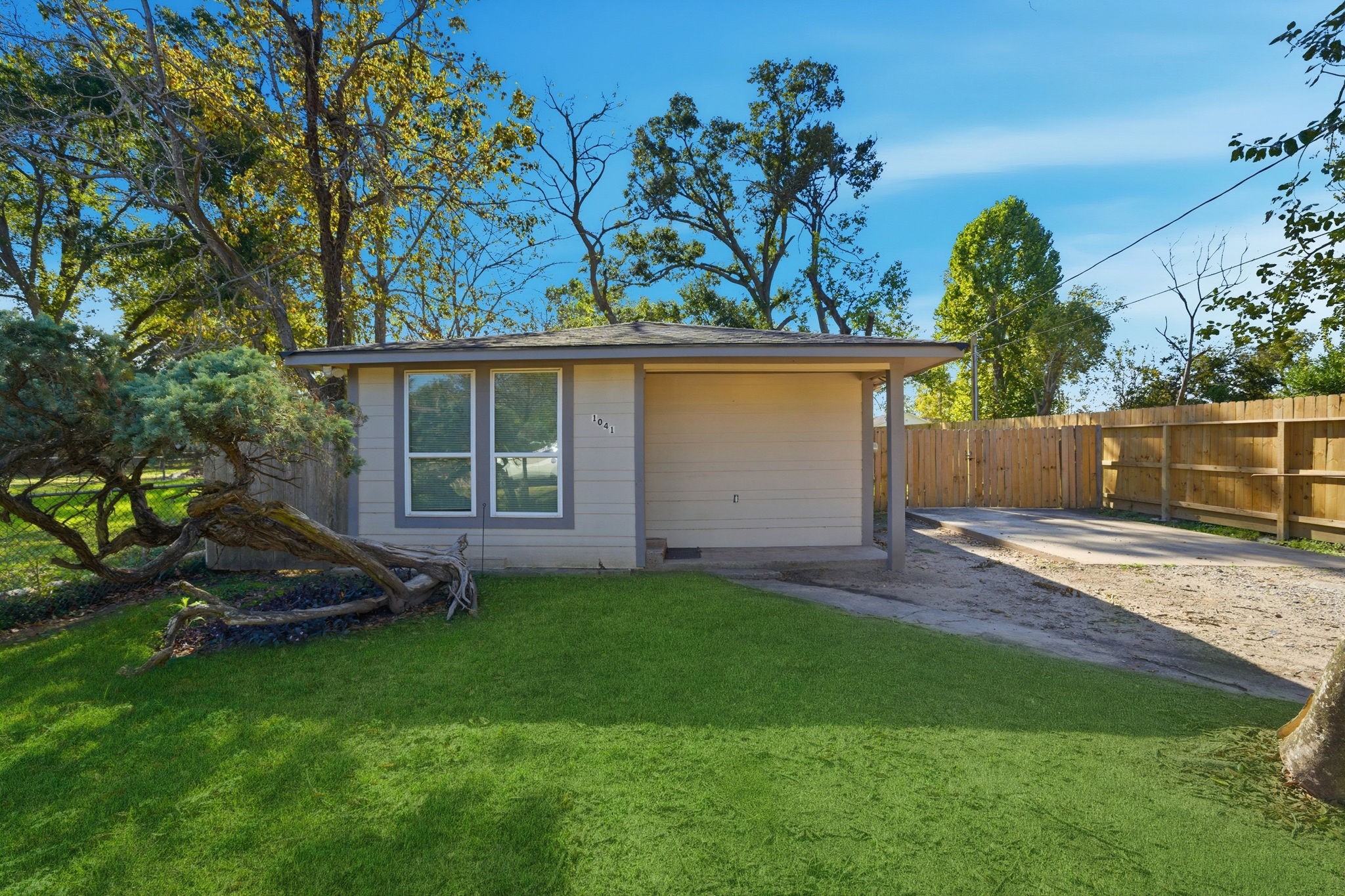1041 Dolly Wright Street Houston, TX 77088 - Photo 1 of 12 a backyard of a house with lots of green space
