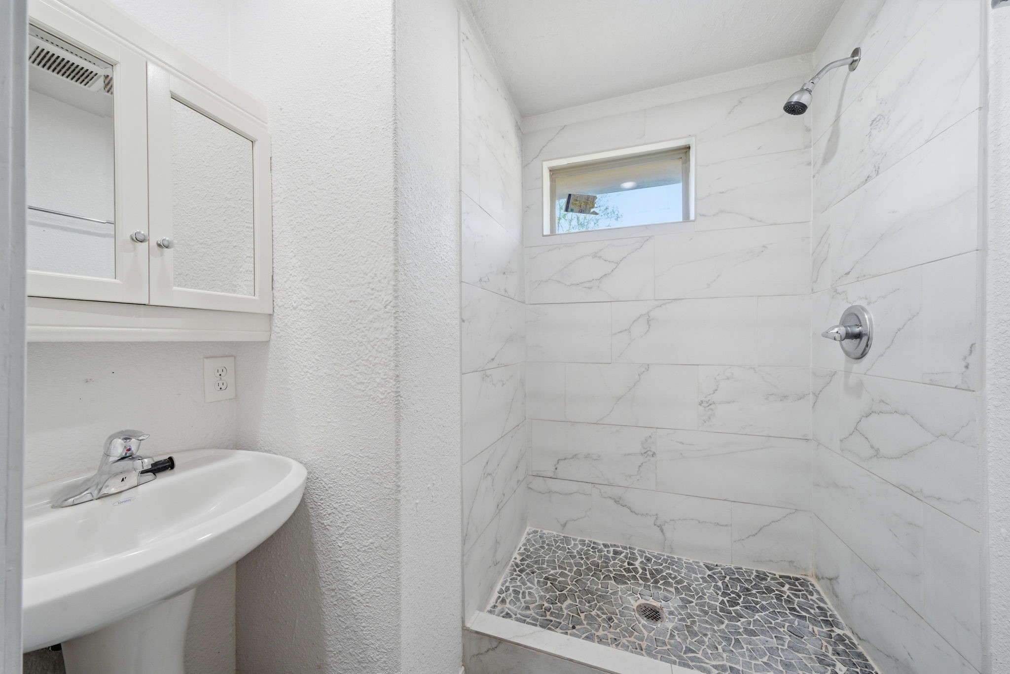 1041 Dolly Wright Street Houston, TX 77088 - Photo 11 of 12 a bathroom with a sink a toilet and vanity