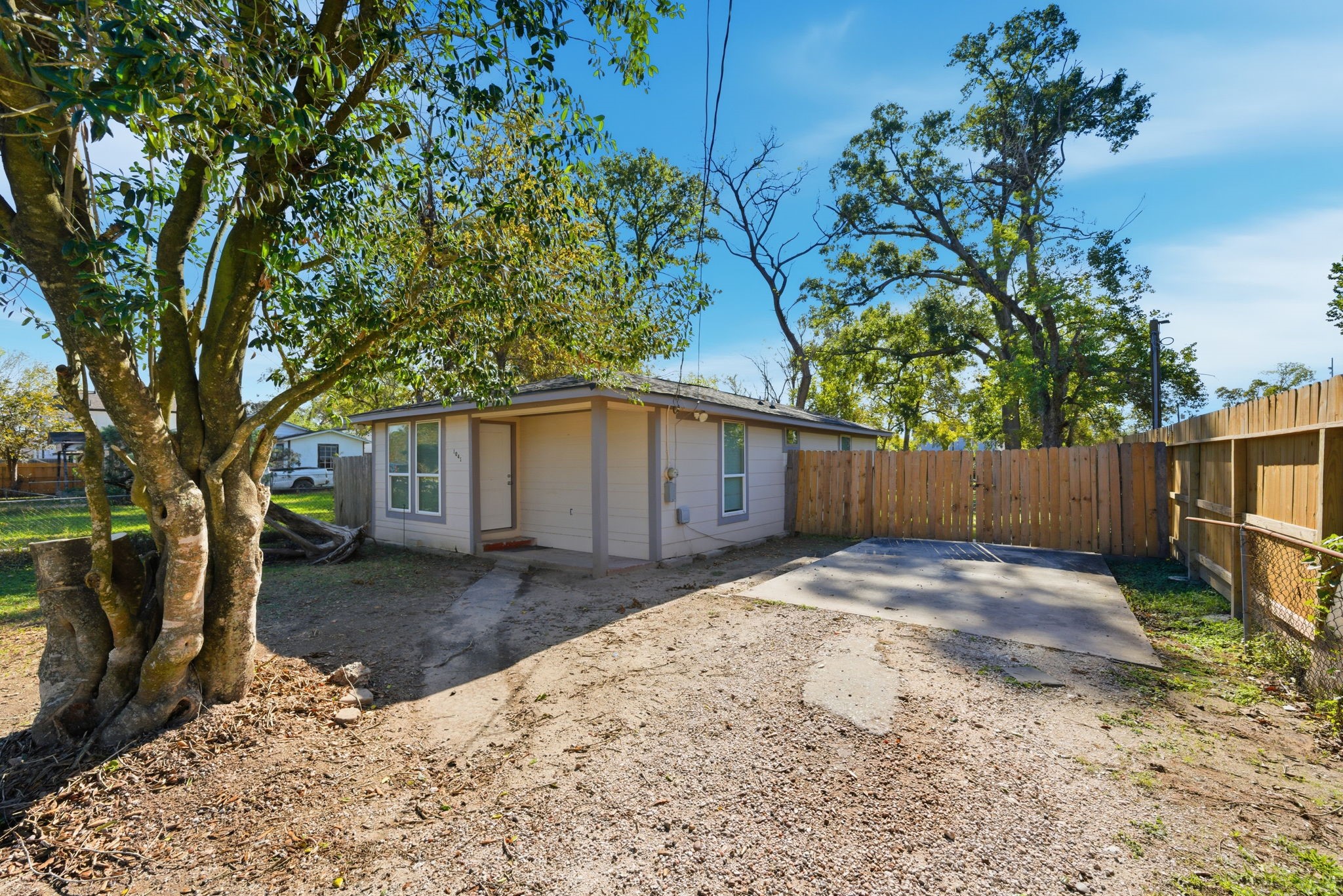 1041 Dolly Wright Street Houston, TX 77088 - Photo 2 of 12 a white house that has tree in front of it