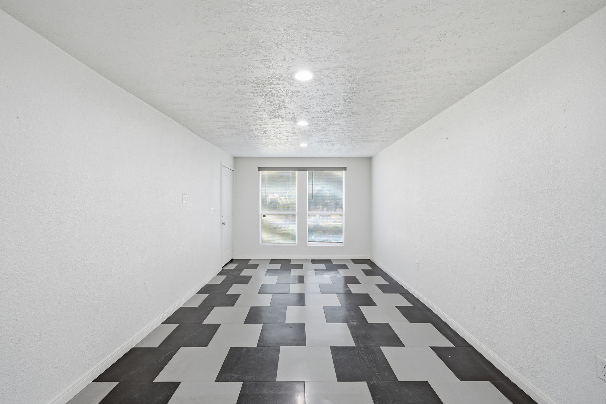 1041 Dolly Wright Street Houston, TX 77088 - Photo 4 of 12 a view of an empty room and a window