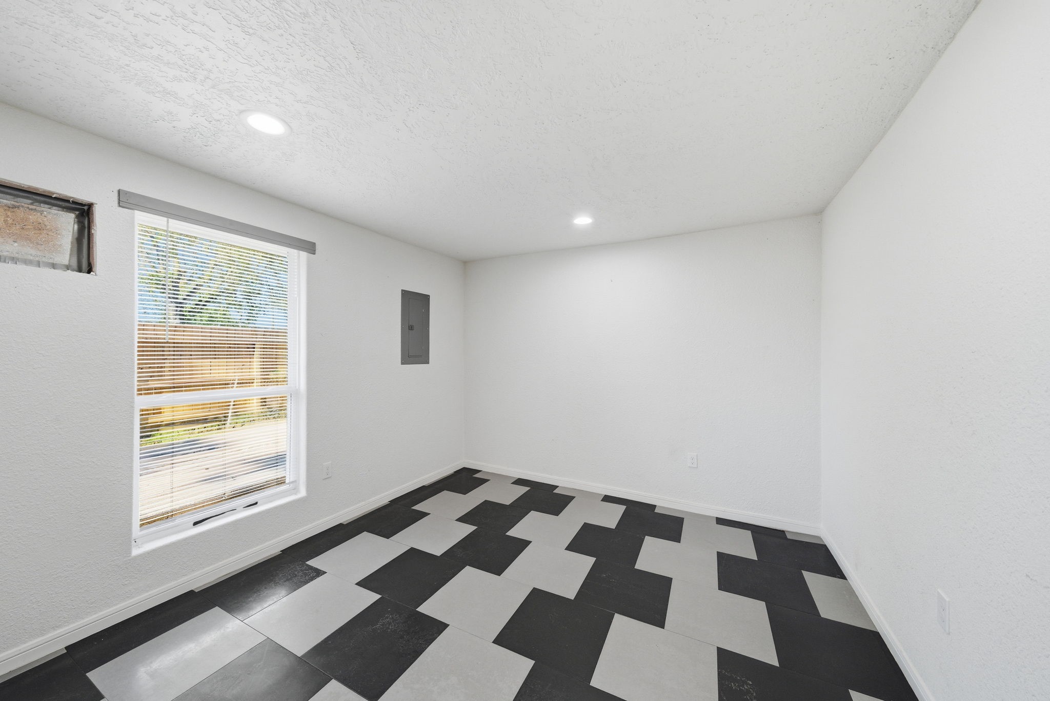 1041 Dolly Wright Street Houston, TX 77088 - Photo 10 of 12 a view of a black and white checkered floor