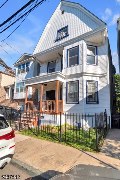19 North 7th Street, Unit 2 Newark, NJ 07107 - Photo 1 of 21 a front view of a house with a garden
