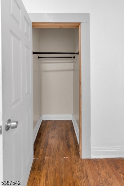 19 North 7th Street, Unit 2 Newark, NJ 07107 - Photo 16 of 21 a view of a room with wooden floor and a ceiling fan