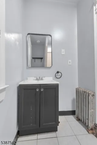 a bathroom with a double vanity sink and mirror