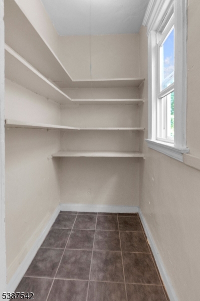 19 North 7th Street, Unit 2 Newark, NJ 07107 - Photo 20 of 21 a view of a room with white cabinets and a window