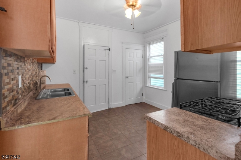 19 North 7th Street, Unit 2 Newark, NJ 07107 - Photo 10 of 21 a kitchen that has a stove and a refrigerator