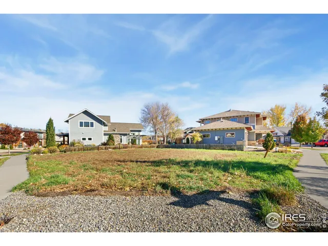 a front view of house with yard and trees