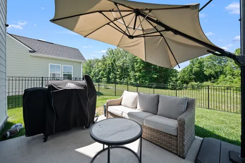 a balcony view with a seating space