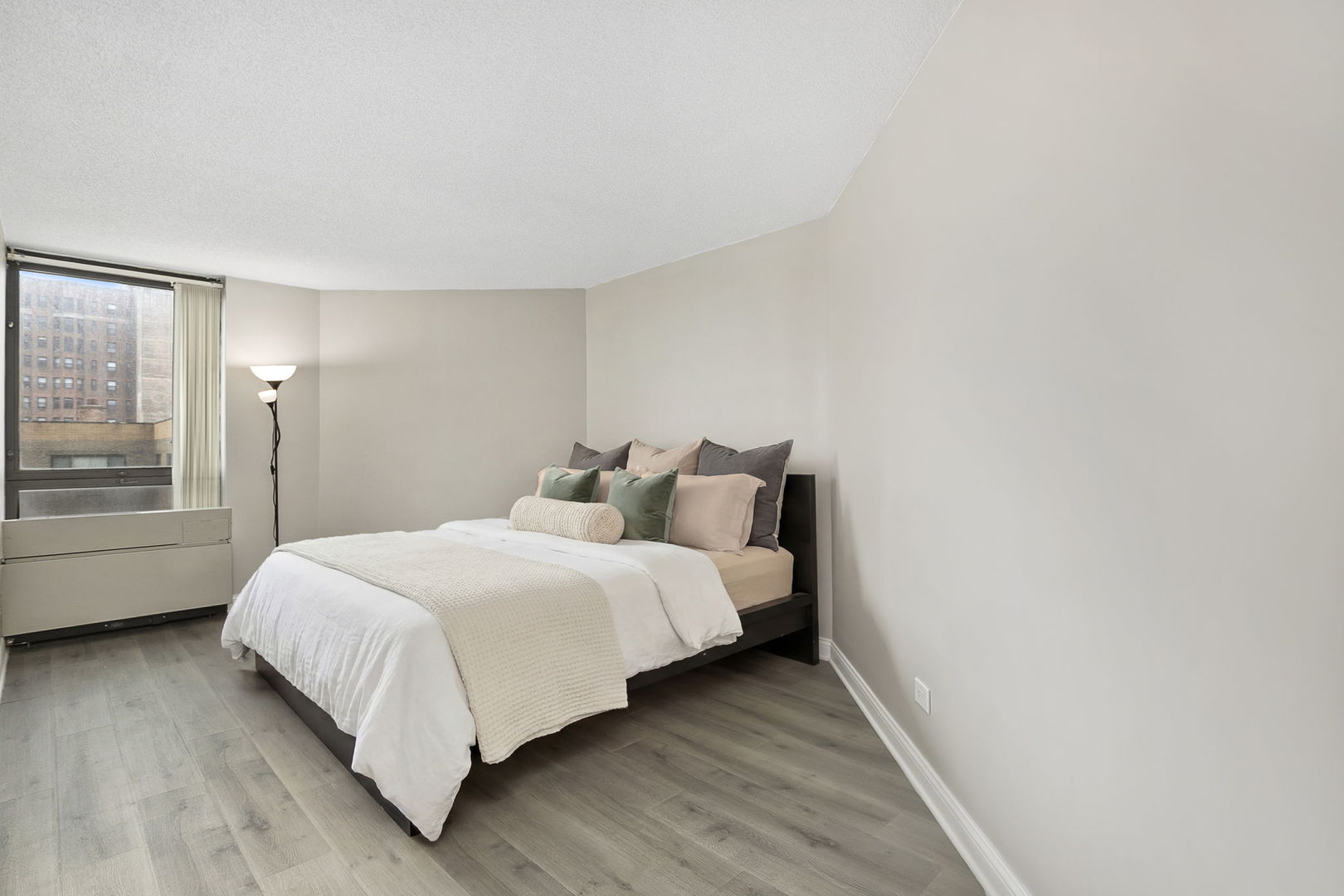 5320 North Sheridan Road, Unit 403 Chicago, IL 60640 - Photo 14 of 36 a bedroom with a bed and window