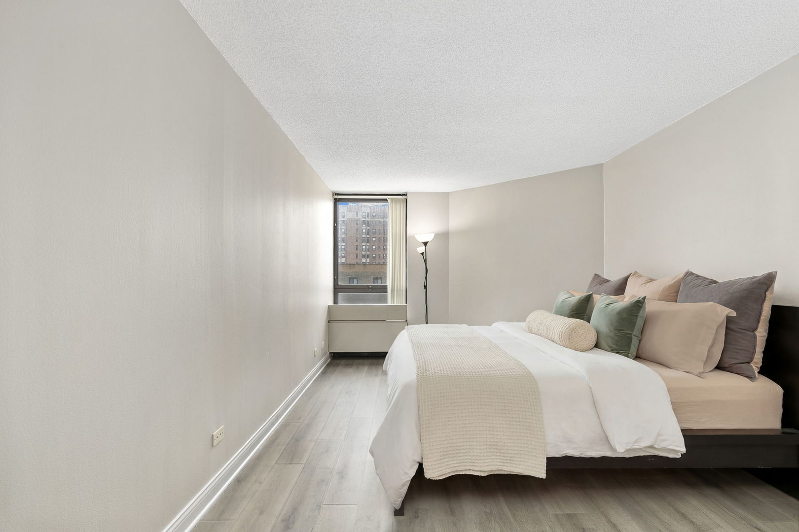 5320 North Sheridan Road, Unit 403 Chicago, IL 60640 - Photo 15 of 36 a bedroom with a bed and a window