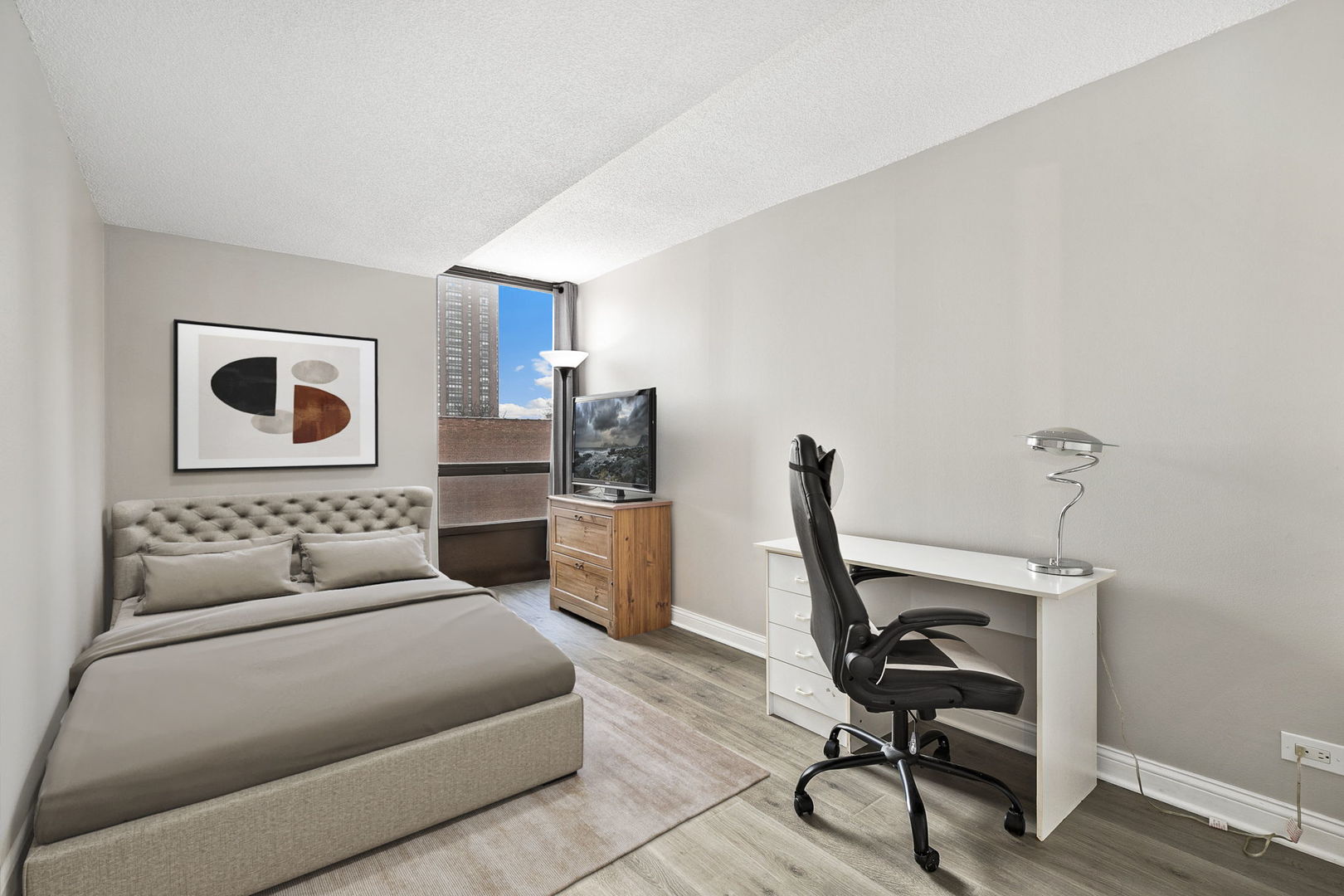 5320 North Sheridan Road, Unit 403 Chicago, IL 60640 - Photo 19 of 36 a bedroom with a bed and furniture