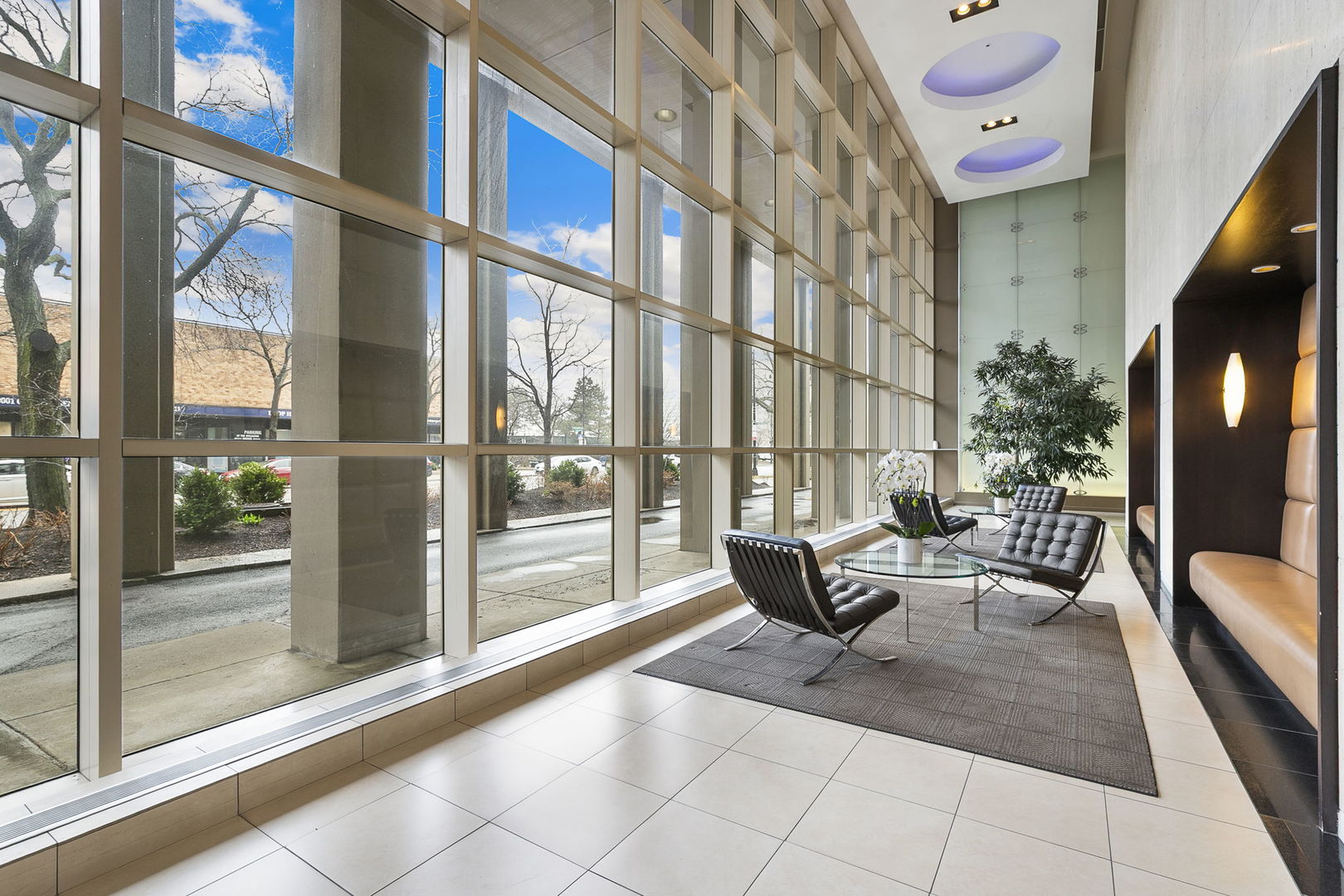 5320 North Sheridan Road, Unit 403 Chicago, IL 60640 - Photo 22 of 36 a living room with furniture and a floor to ceiling window
