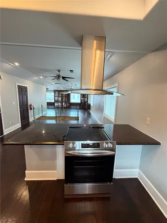 a kitchen with a stove and a refrigerator