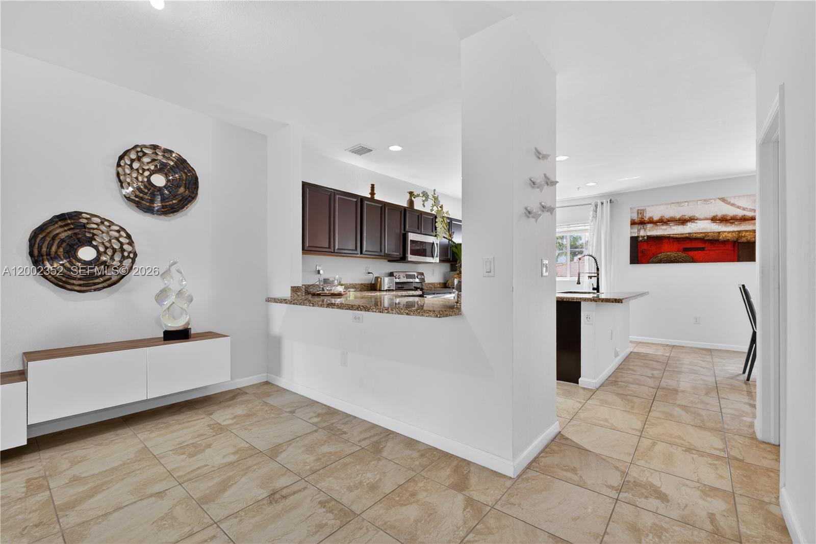 14213 Southwest 274th Street Homestead, FL 33032 - Photo 14 of 62 a view of kitchen with stainless steel appliances granite countertop a refrigerator and a stove top oven