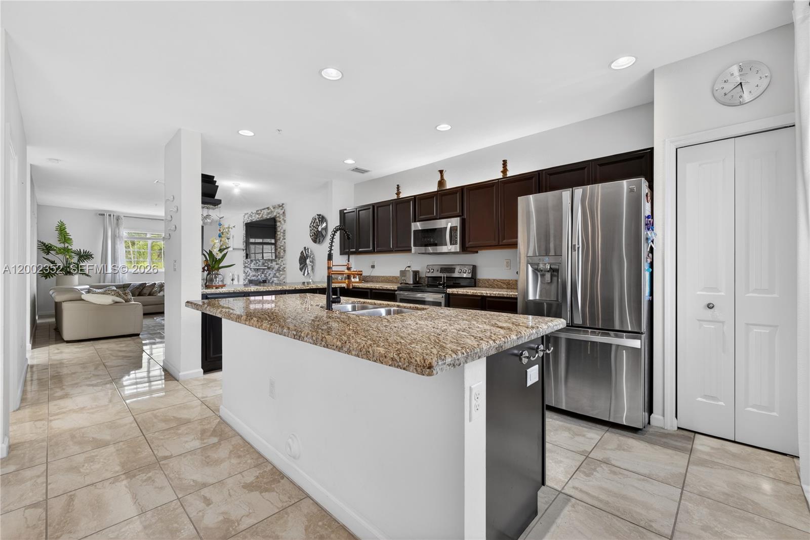 14213 Southwest 274th Street Homestead, FL 33032 - Photo 16 of 62 a kitchen with stainless steel appliances granite countertop a refrigerator and a sink