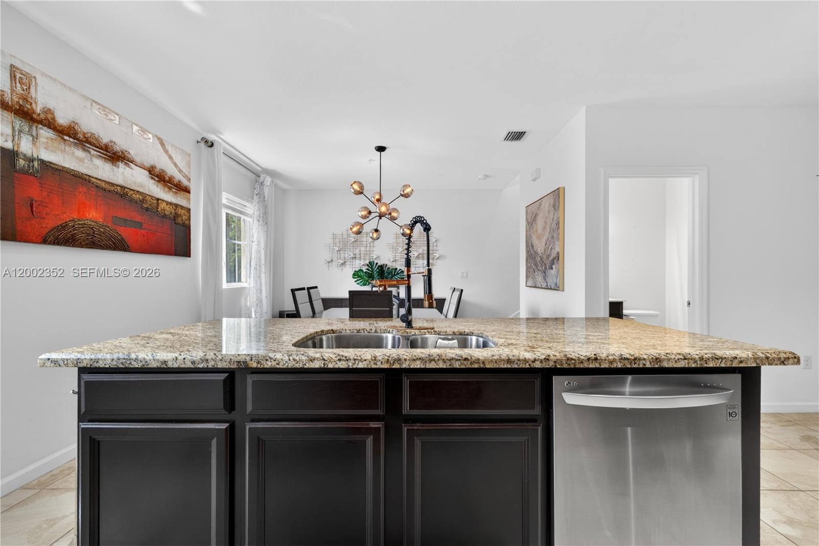 14213 Southwest 274th Street Homestead, FL 33032 - Photo 17 of 62 a bathroom with a granite countertop sink and a mirror
