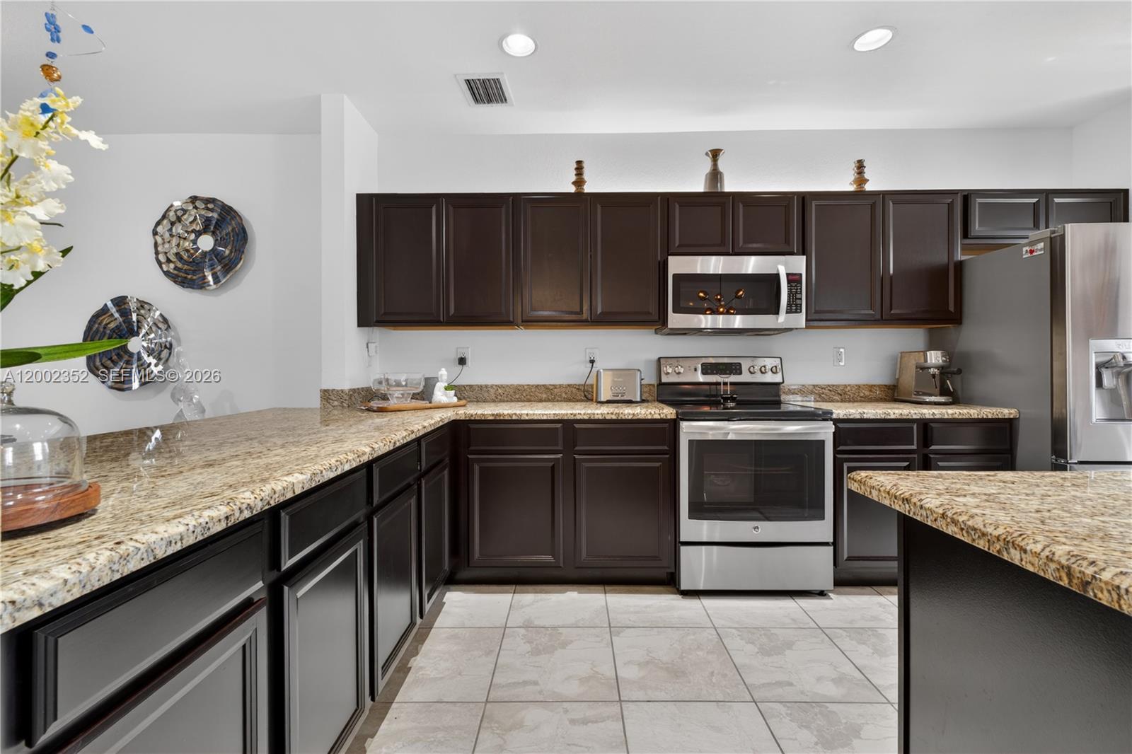 14213 Southwest 274th Street Homestead, FL 33032 - Photo 21 of 62 a kitchen with a sink and a stove top oven with wooden floor