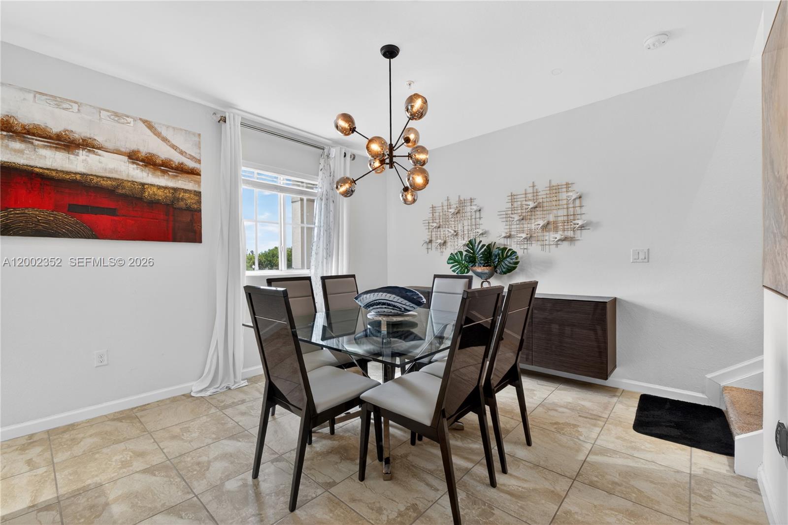 14213 Southwest 274th Street Homestead, FL 33032 - Photo 24 of 62 a view of a dining room with furniture and chandelier