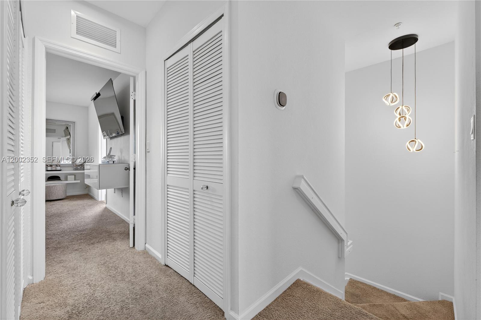 14213 Southwest 274th Street Homestead, FL 33032 - Photo 26 of 62 a view of a hallway with a livingroom and a bathroom