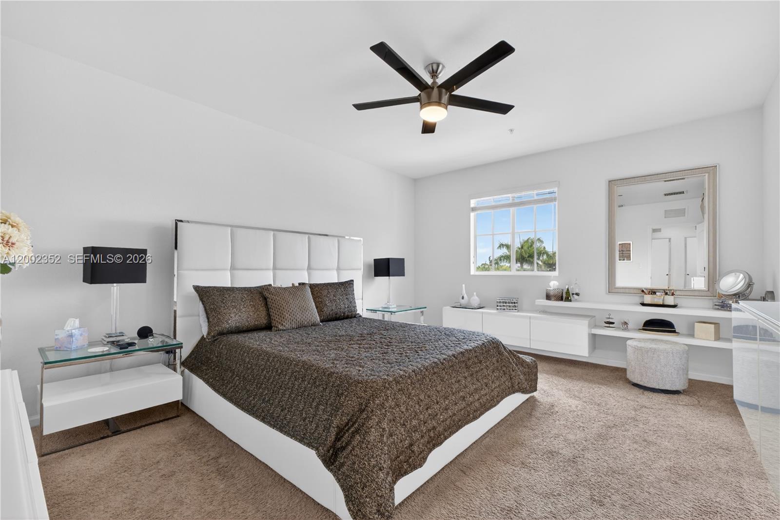 14213 Southwest 274th Street Homestead, FL 33032 - Photo 28 of 62 a bedroom with a large bed and ceiling fan