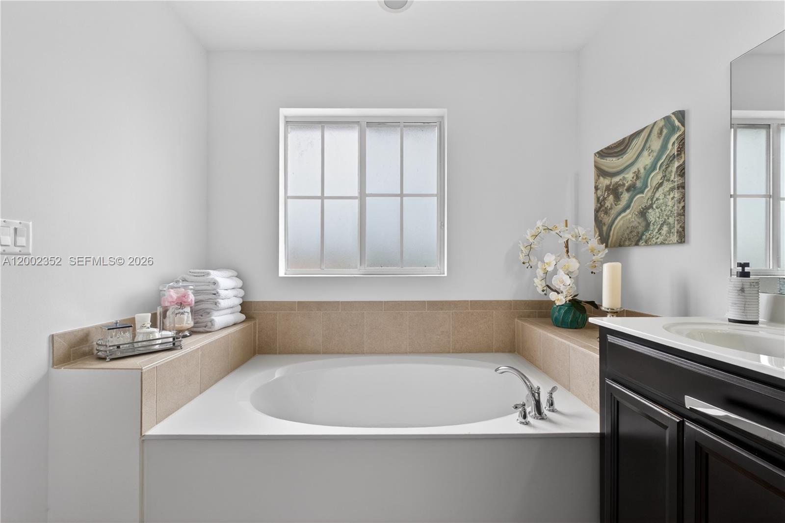 14213 Southwest 274th Street Homestead, FL 33032 - Photo 31 of 62 a white bath tub sitting next to a white sink