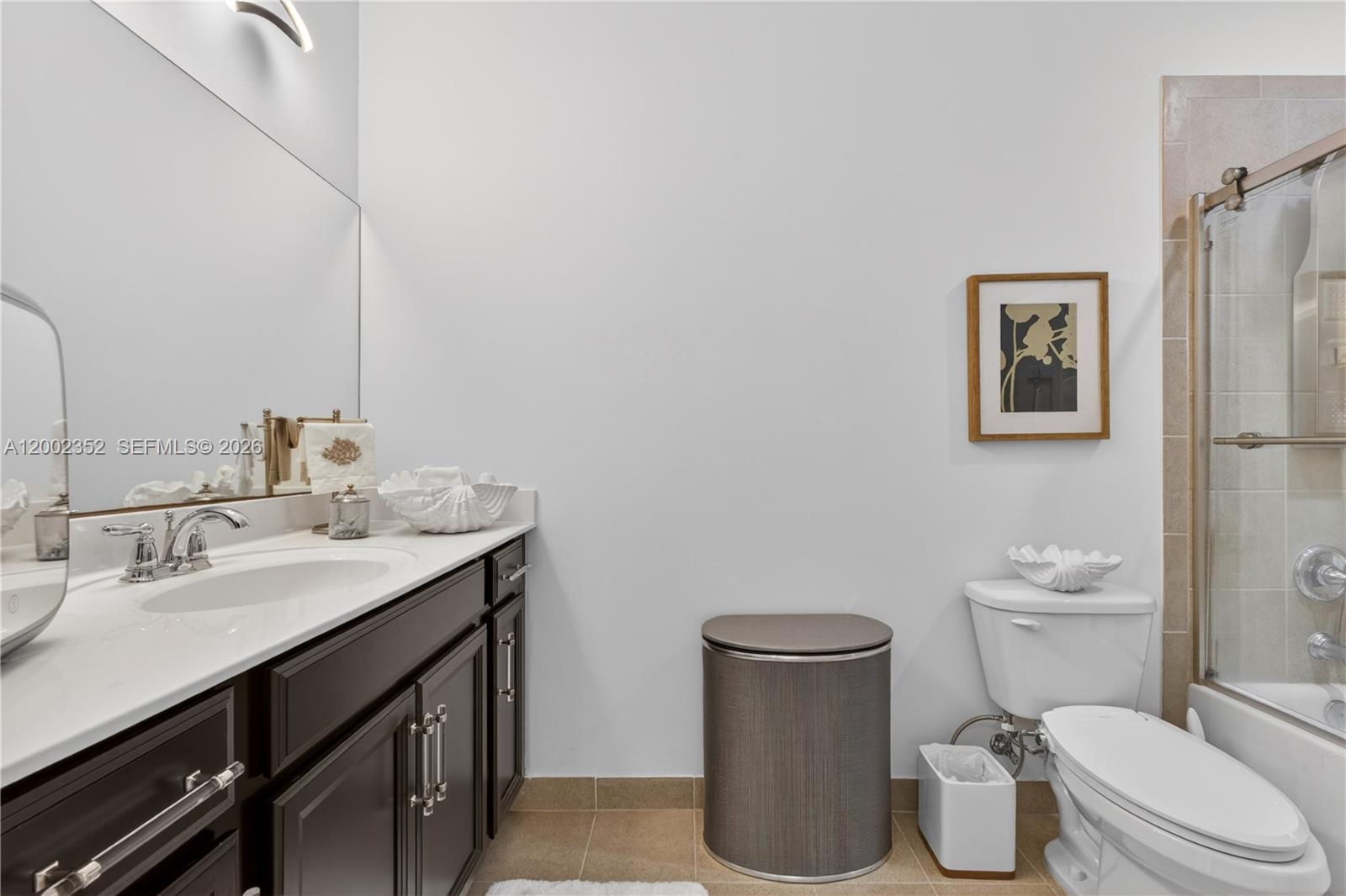 14213 Southwest 274th Street Homestead, FL 33032 - Photo 37 of 62 a bathroom with a granite countertop toilet sink and mirror