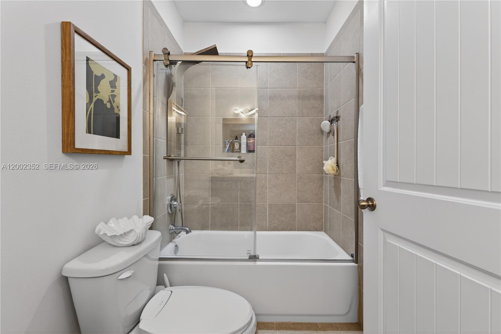 14213 Southwest 274th Street Homestead, FL 33032 - Photo 38 of 62 a bathroom with a toilet sink and shower