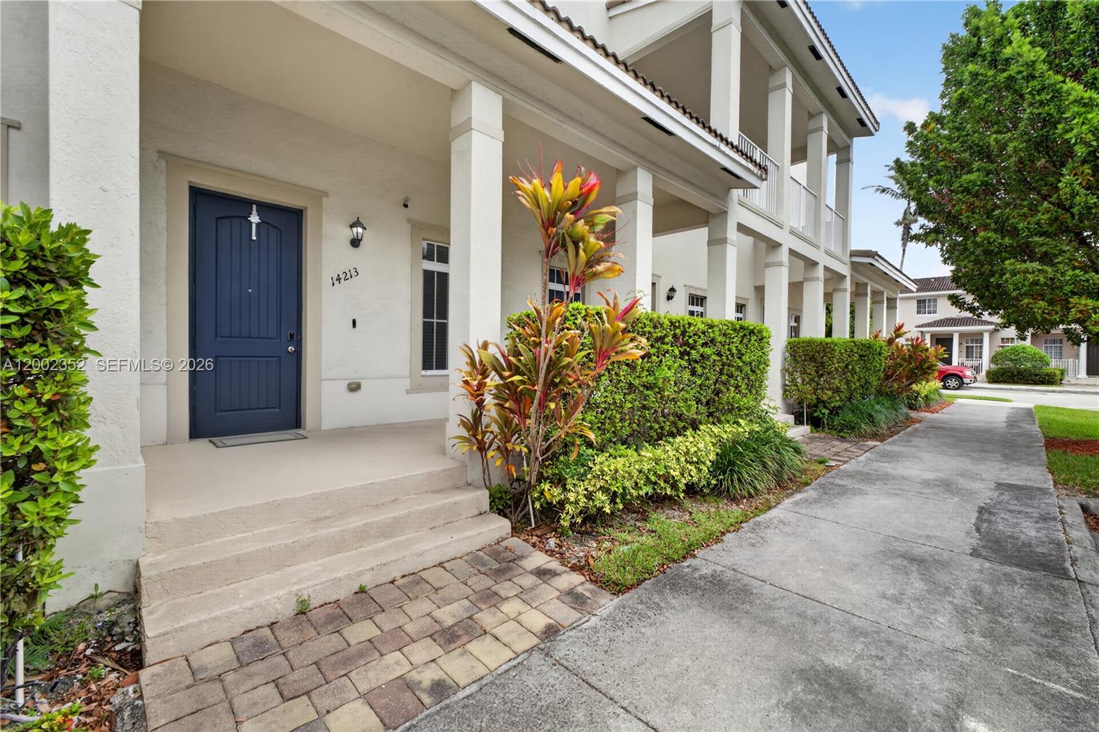14213 Southwest 274th Street Homestead, FL 33032 - Photo 4 of 62 a view of a building with potted plants