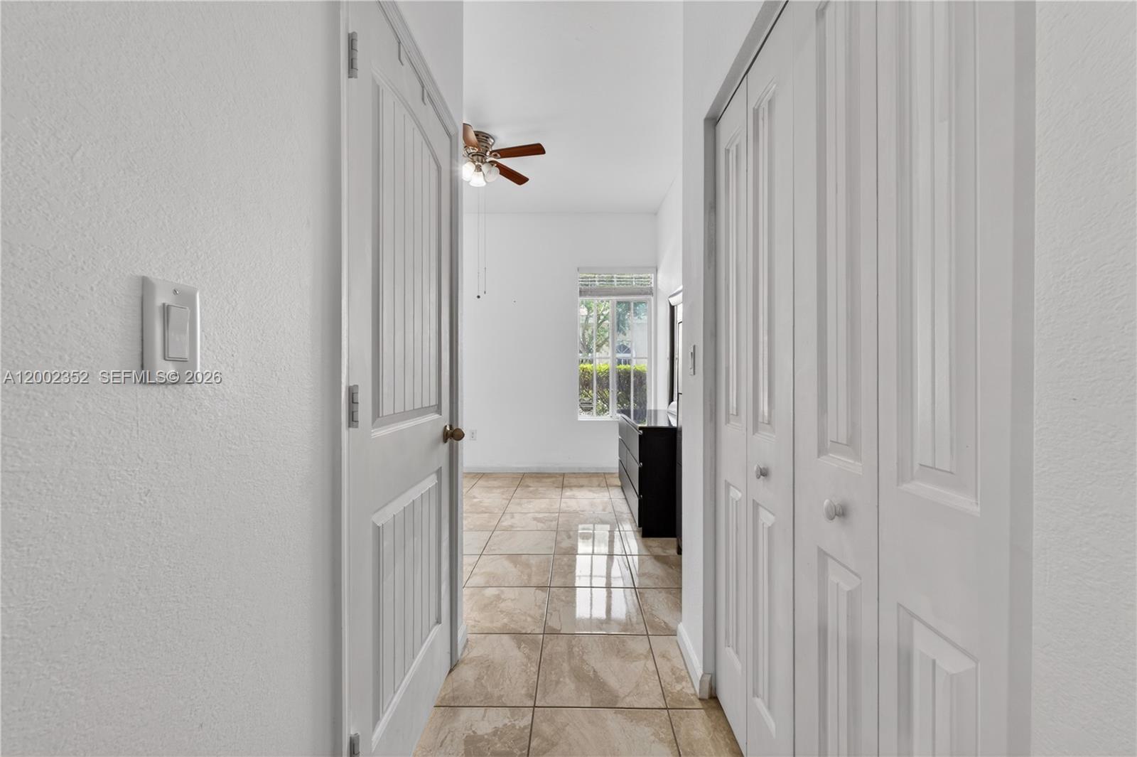 14213 Southwest 274th Street Homestead, FL 33032 - Photo 47 of 62 a view of a hallway with a livingroom and a bathroom