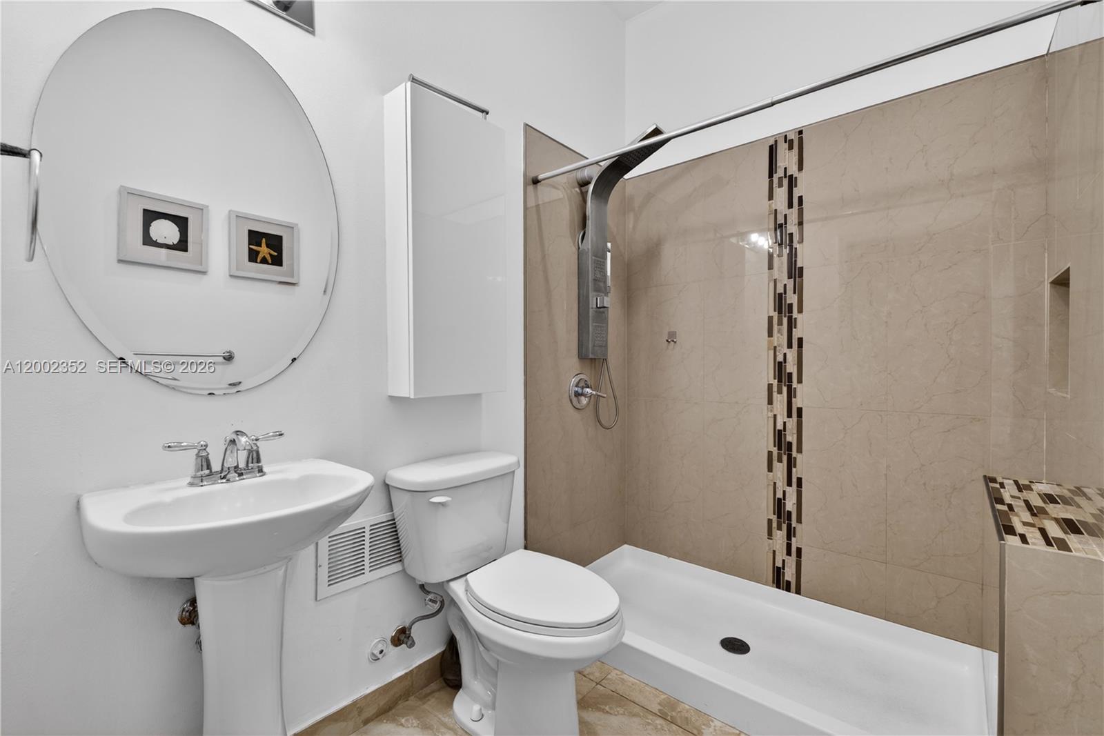 14213 Southwest 274th Street Homestead, FL 33032 - Photo 50 of 62 a bathroom with a sink toilet and shower