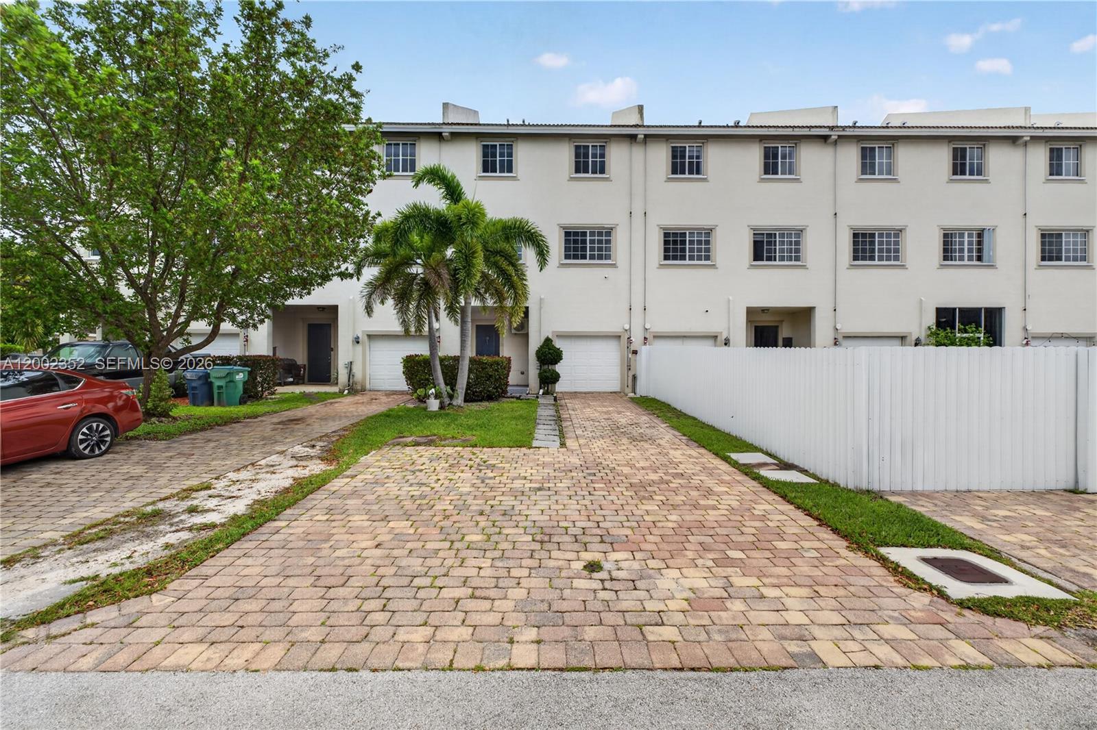 14213 Southwest 274th Street Homestead, FL 33032 - Photo 51 of 62 a front view of a house with a yard and trees
