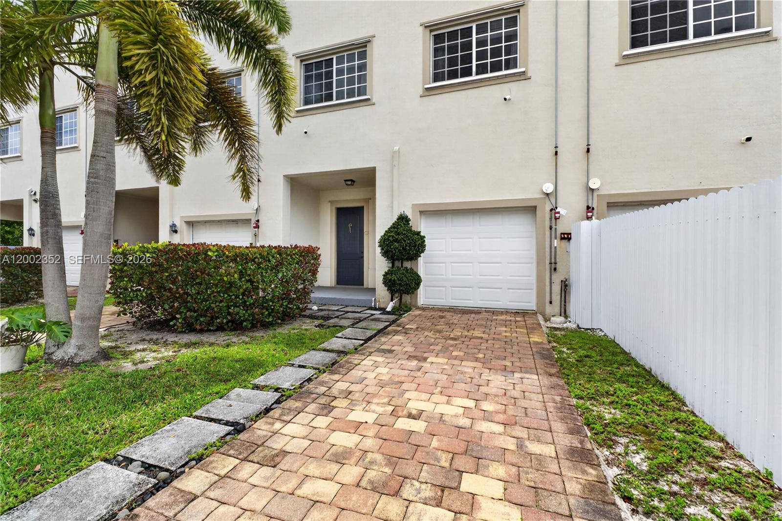 14213 Southwest 274th Street Homestead, FL 33032 - Photo 52 of 62 a front view of a house with a yard