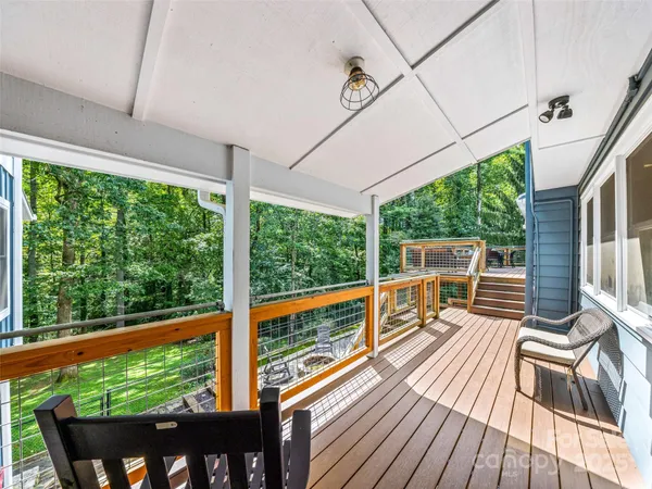 a view of balcony with couch and wooden floor