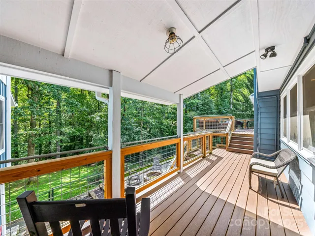 a view of balcony with couch and wooden floor