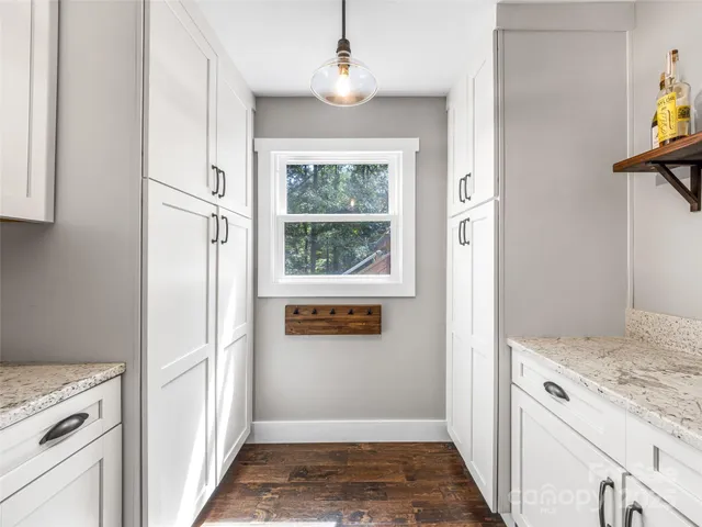 a view of a kitchen from the hallway