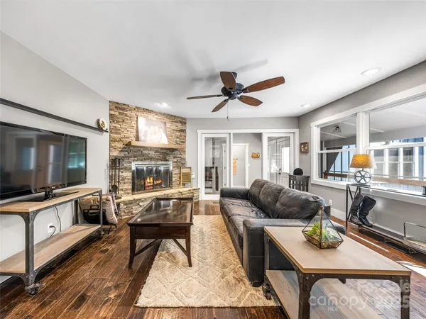 a living room with furniture and a flat screen tv