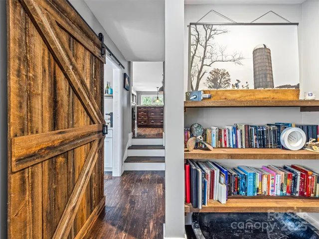 a book shelf with lounge chair