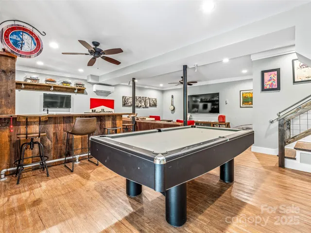 a living room with stainless steel appliances kitchen island granite countertop furniture and a kitchen view