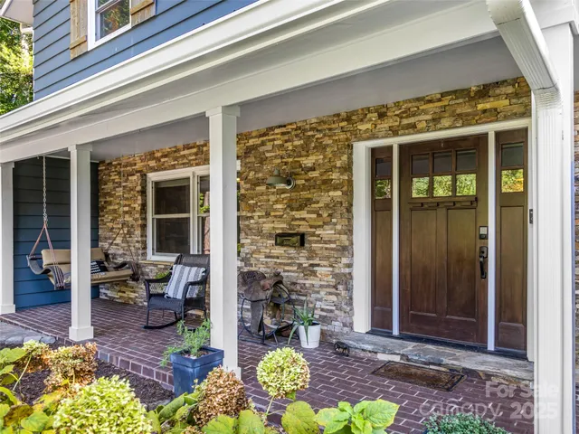 front view of two house with outdoor seating