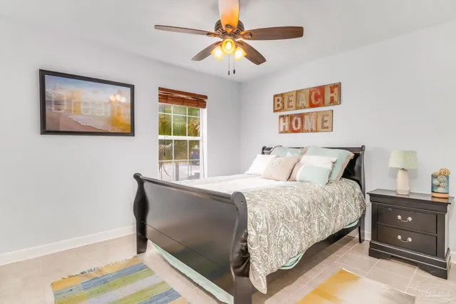 a bedroom with bed and a window