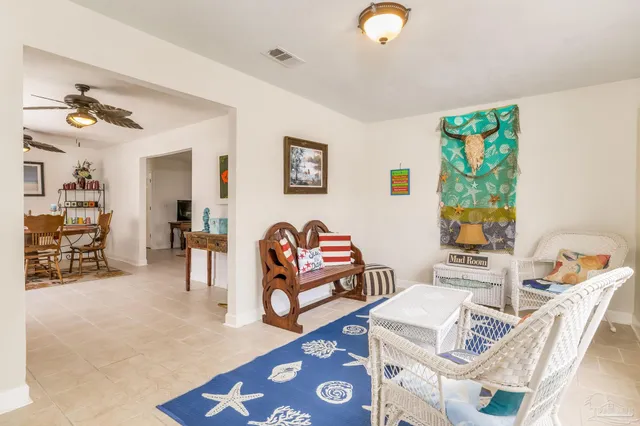 a living room with furniture and a table