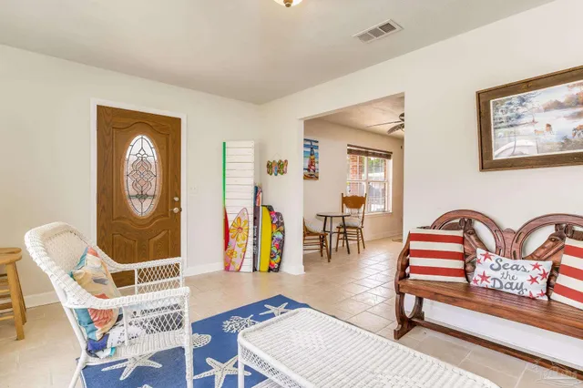 a bedroom with furniture and a window