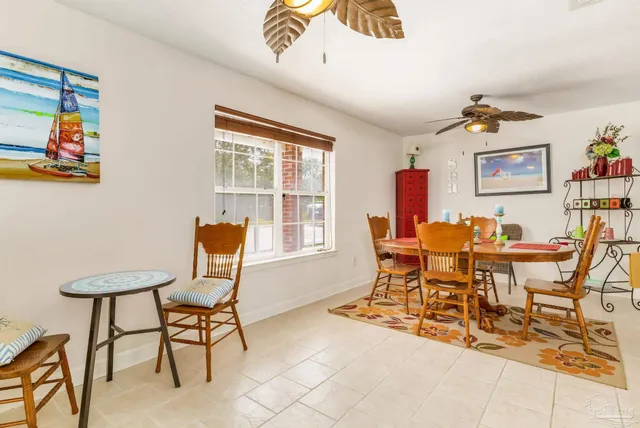 a dining room with furniture and window