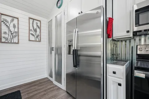 a kitchen with a stove and a microwave