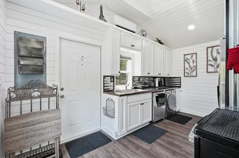 a kitchen with stainless steel appliances granite countertop a stove and a refrigerator