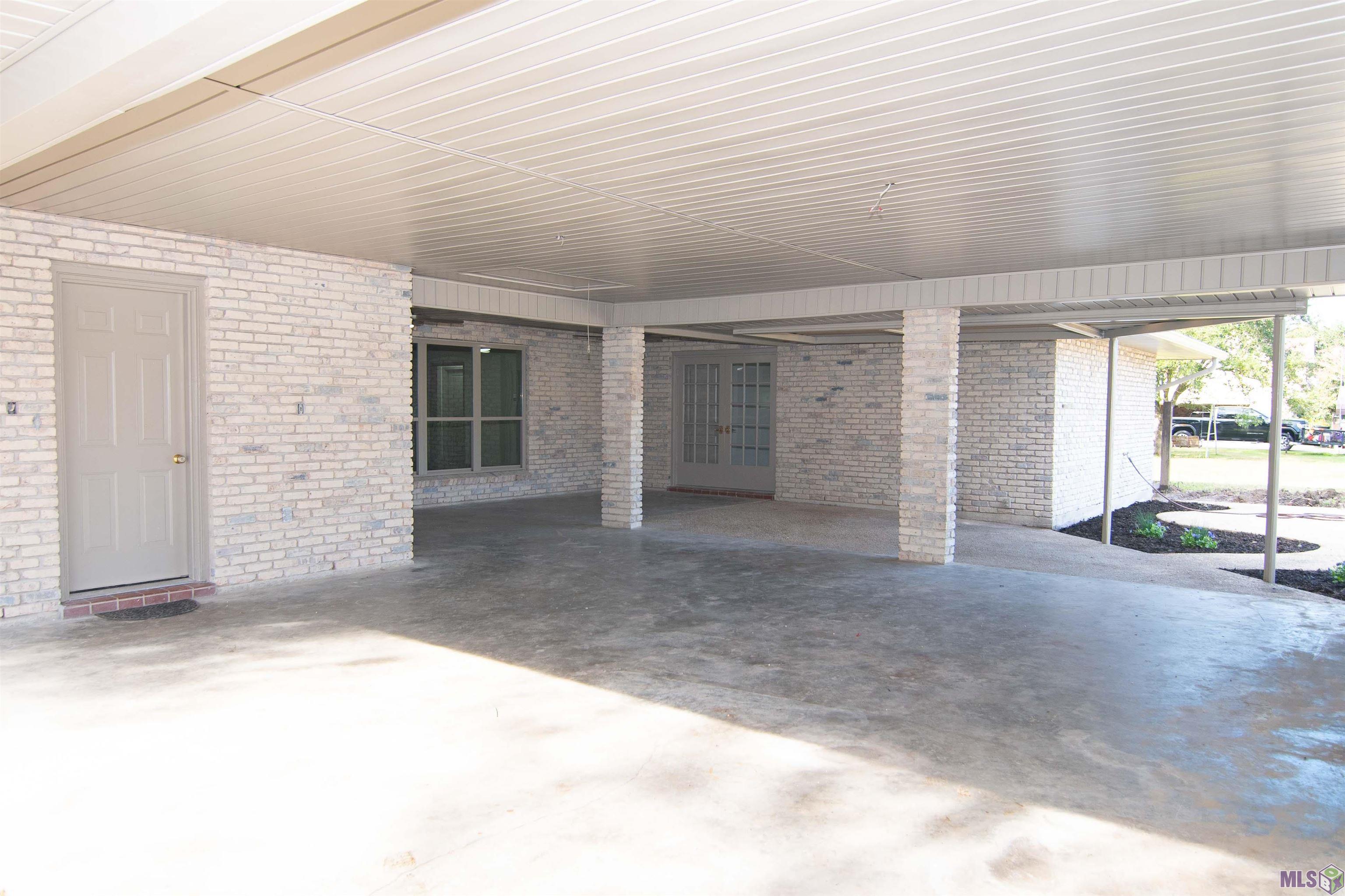 12472 Gravois Subdivision Road Gonzales, LA 70737 - Photo 18 of 37 Carport and patio
